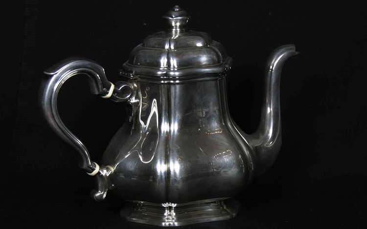 Served in solid silver tea, coffee and sugar pot