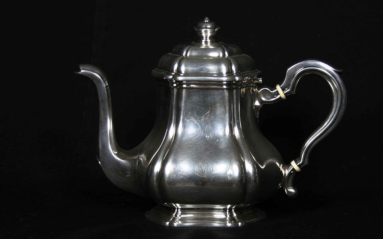 Served in solid silver tea, coffee and sugar pot