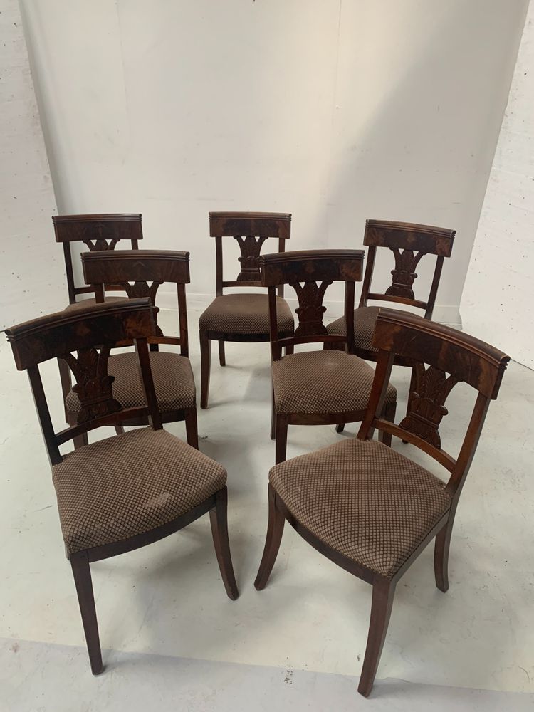 Suite of seven solid mahogany chairs XIX century