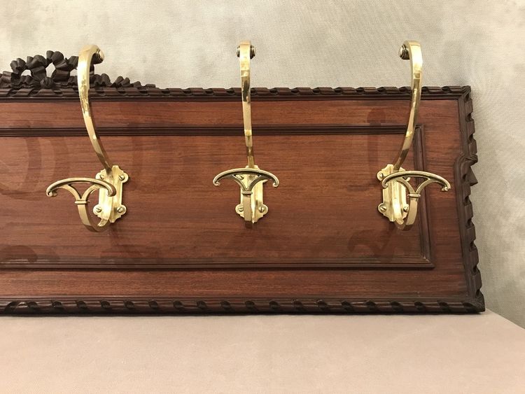 Set of 6 19th century bronze coat hooks on wood