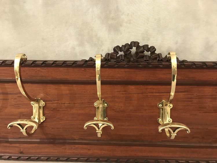 Set of 6 19th century bronze coat hooks on wood