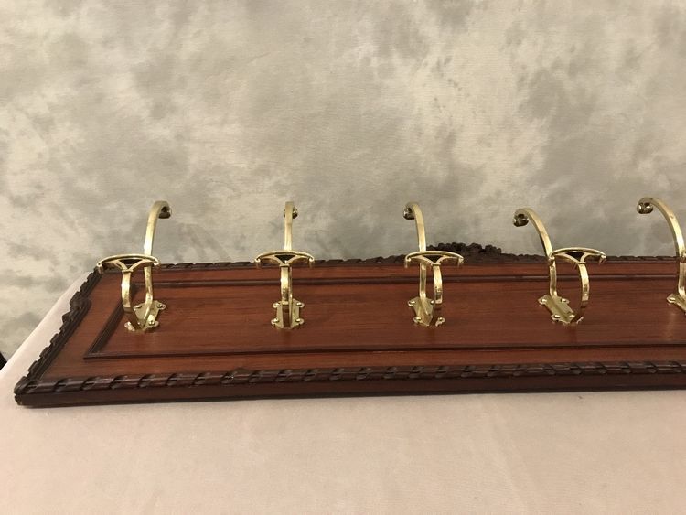 Set of 6 19th century bronze coat hooks on wood