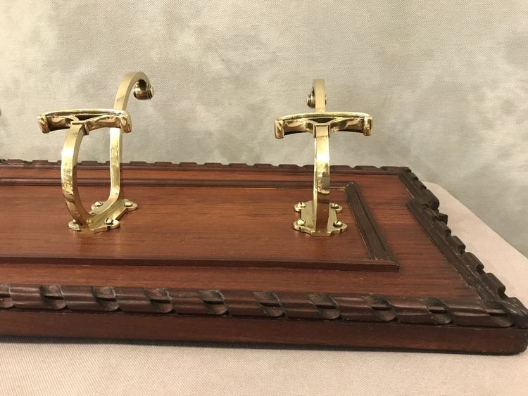 Set of 6 19th century bronze coat hooks on wood