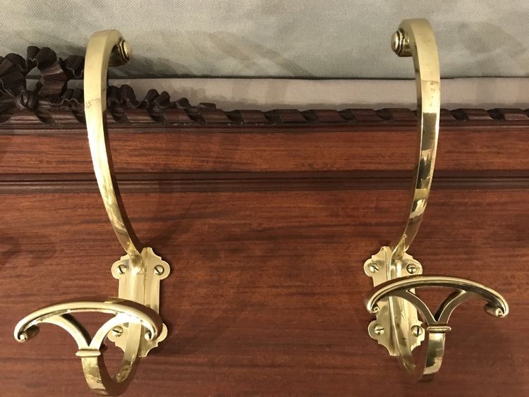 Set of 6 19th century bronze coat hooks on wood