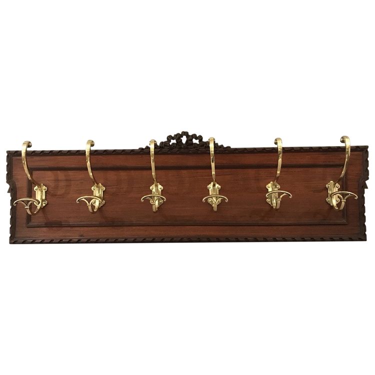Set of 6 19th century bronze coat hooks on wood