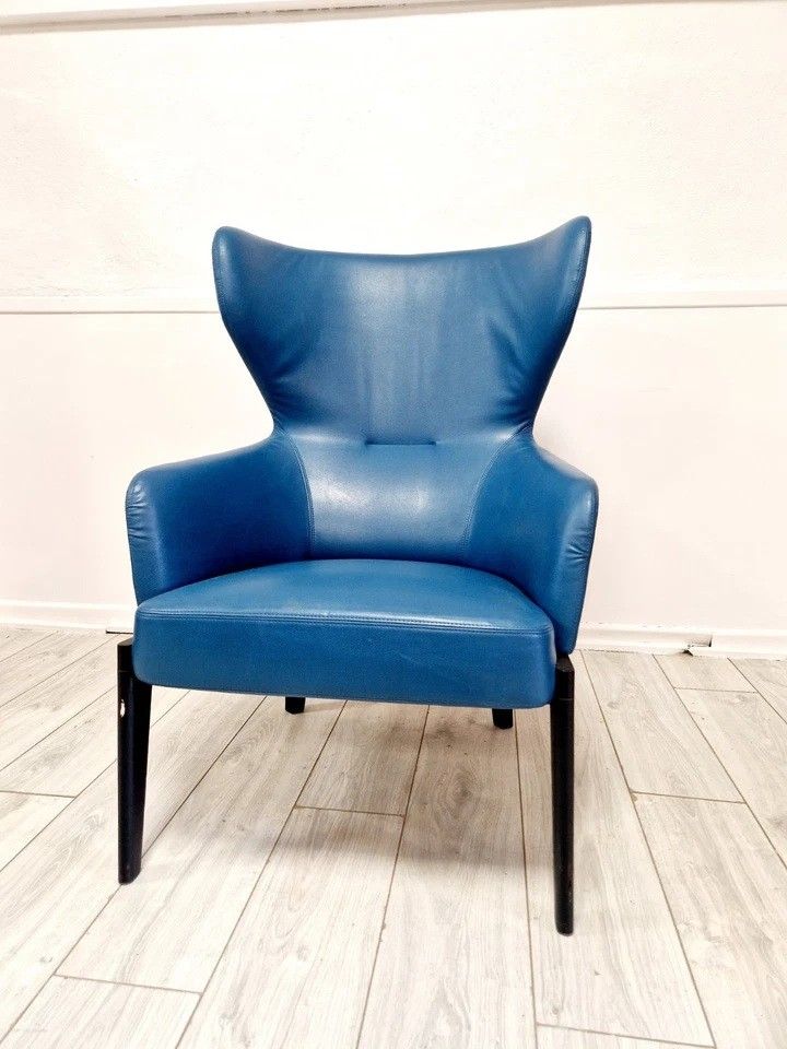 High-back armchair by Rodolfo Dordoni