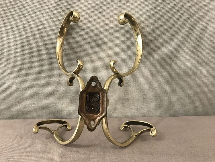19th century double coat hook in polished and varnished brass