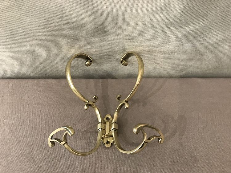 19th century double coat hook in polished and varnished brass