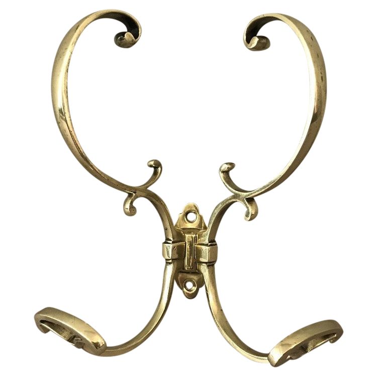 19th century double coat hook in polished and varnished brass
