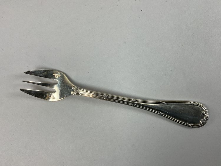 Twelve Christofle cross ribbon oyster forks