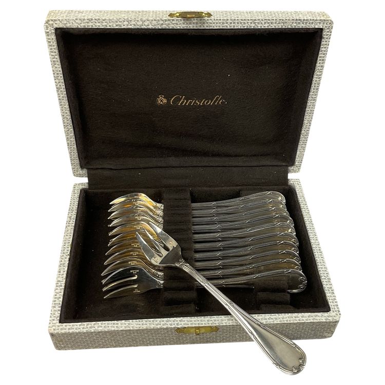 Twelve Christofle cross ribbon oyster forks
