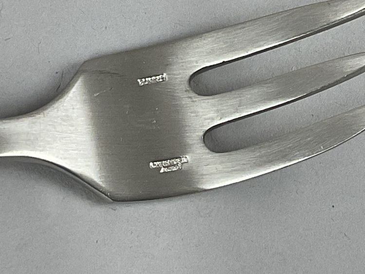 Eight cake forks, steel, Christophe sigma.