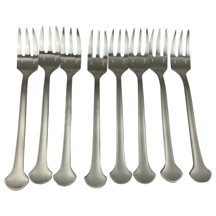 Eight cake forks, steel, Christophe sigma.