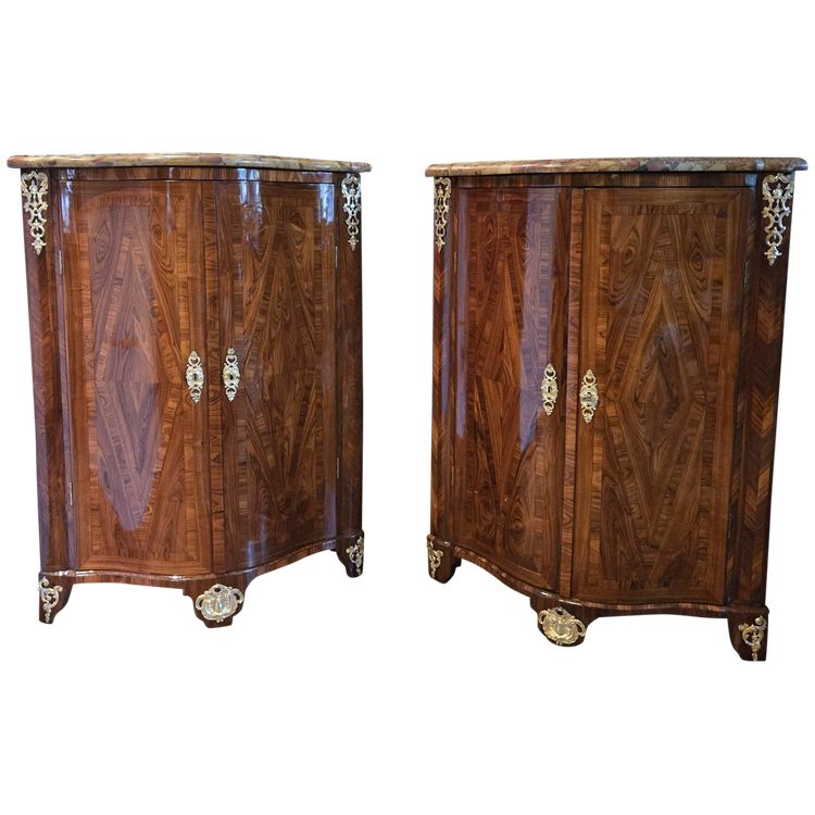Pair of Regency corner cabinets with support height in violet wood.