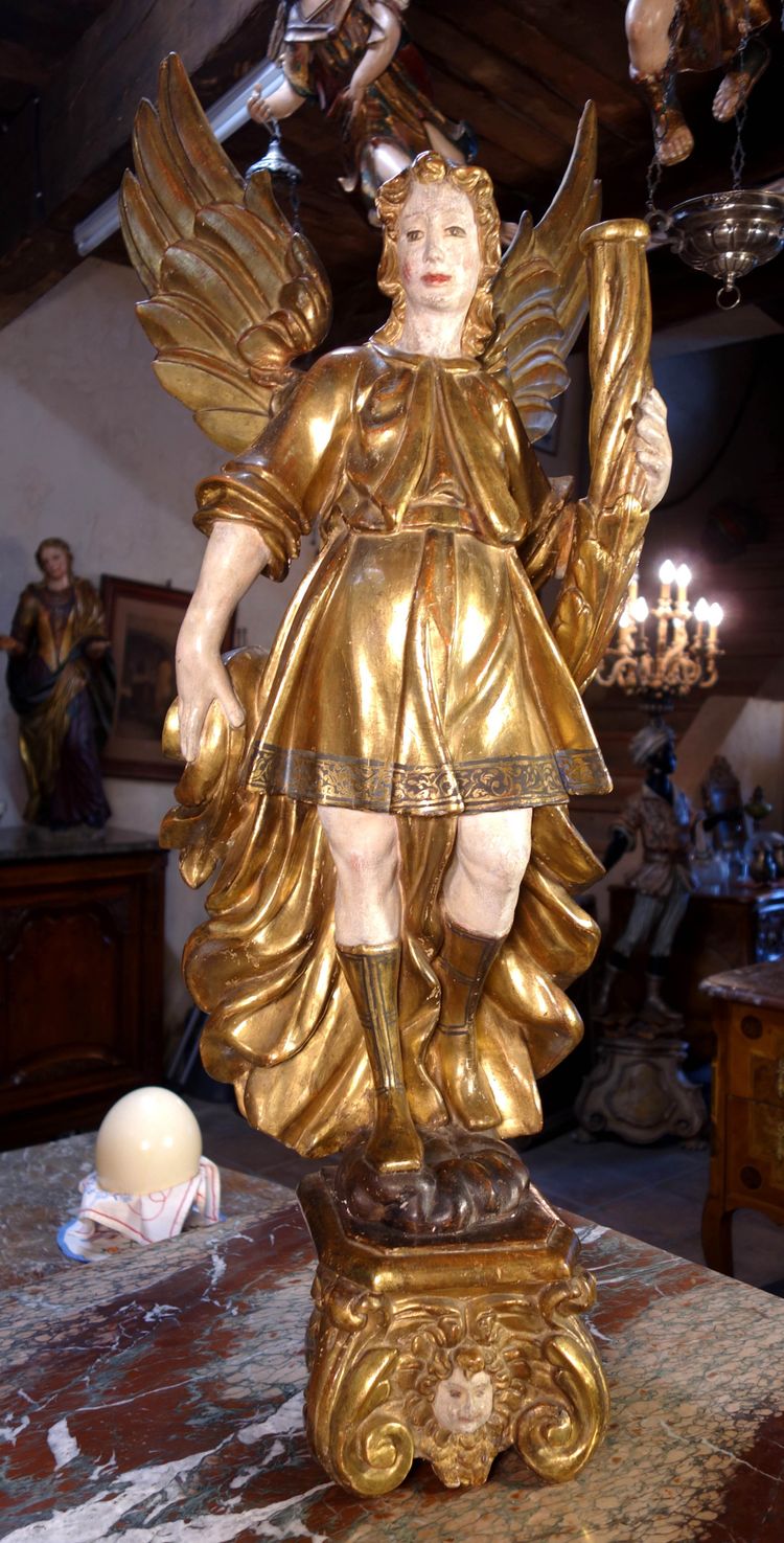 Large pair of gilded wooden torch-bearing angels, 18th century