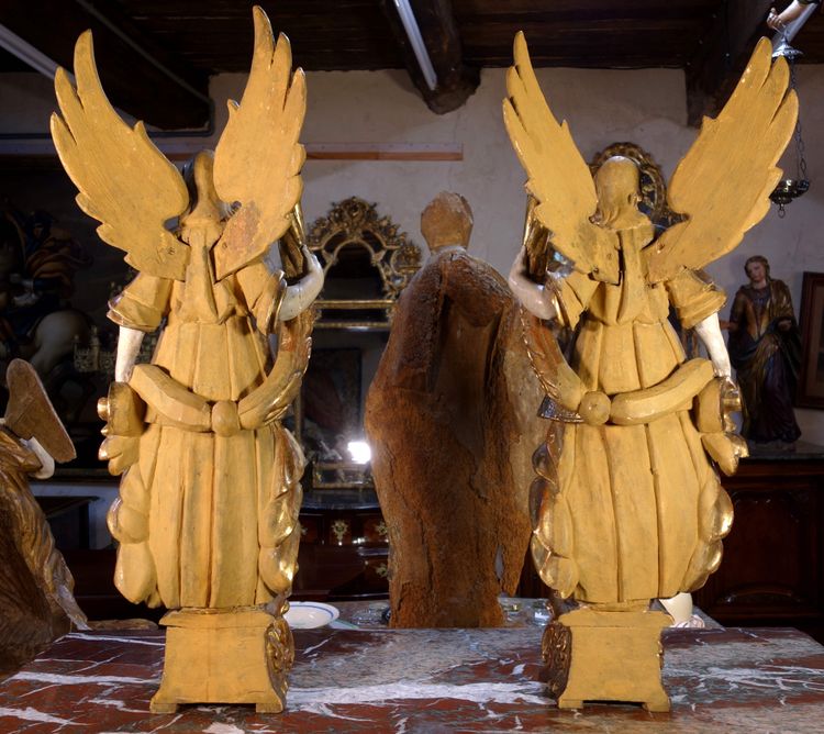 Large pair of gilded wooden torch-bearing angels, 18th century
