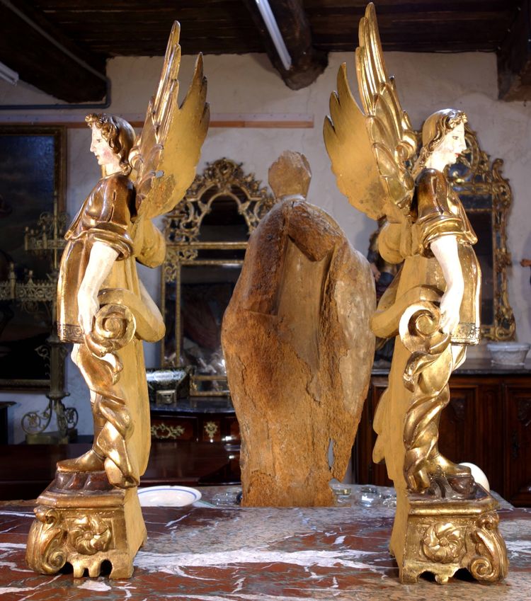 Large pair of gilded wooden torch-bearing angels, 18th century