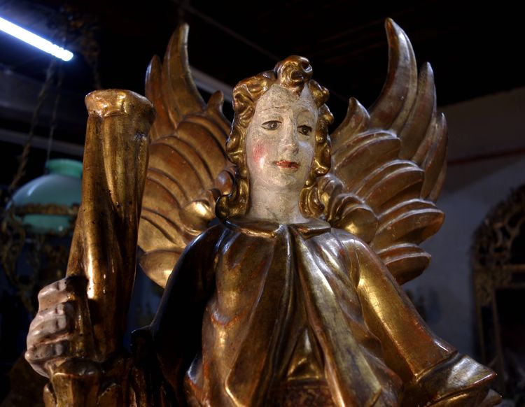 Large pair of gilded wooden torch-bearing angels, 18th century