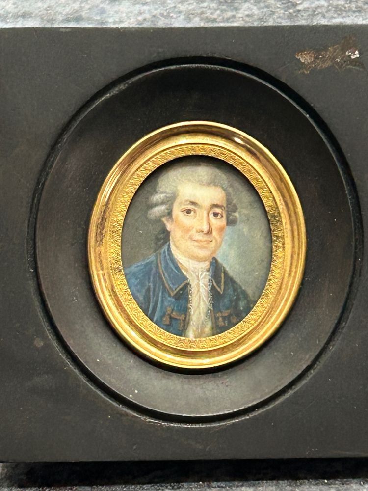 Miniature portrait of a man in a blue jacket from the late 18th century