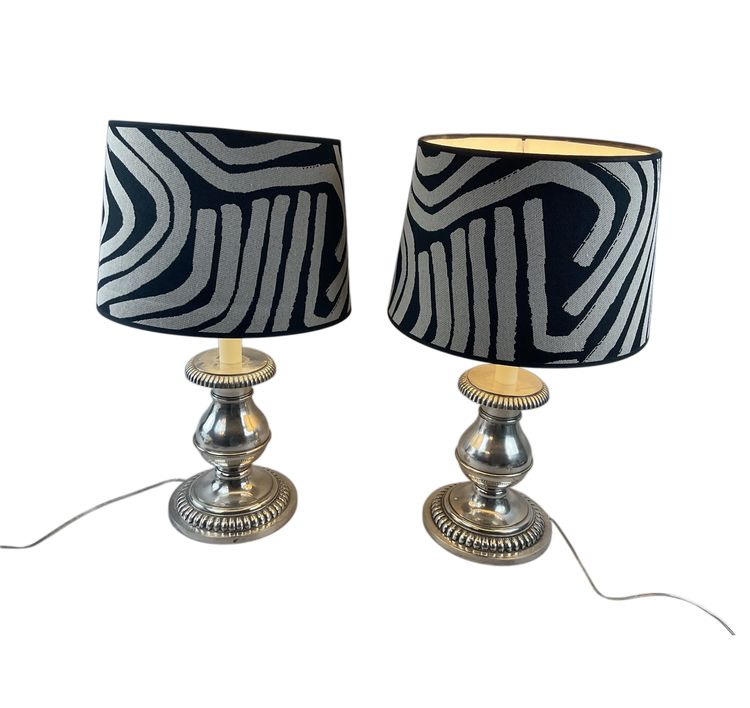 Pair of silver metal lamps