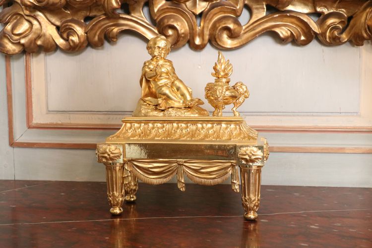 Pair of Louis XVI gilt bronze andirons