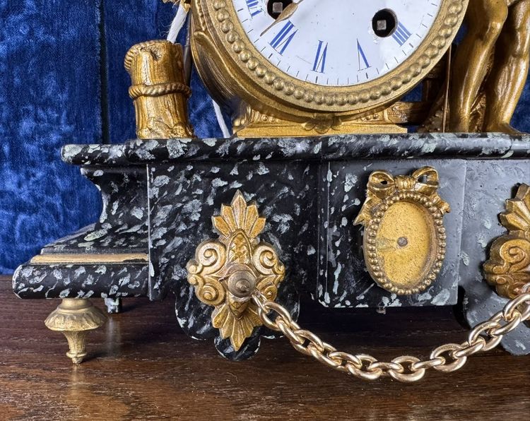 Napoleon III period clock in faux marble painted wood and gilded regule