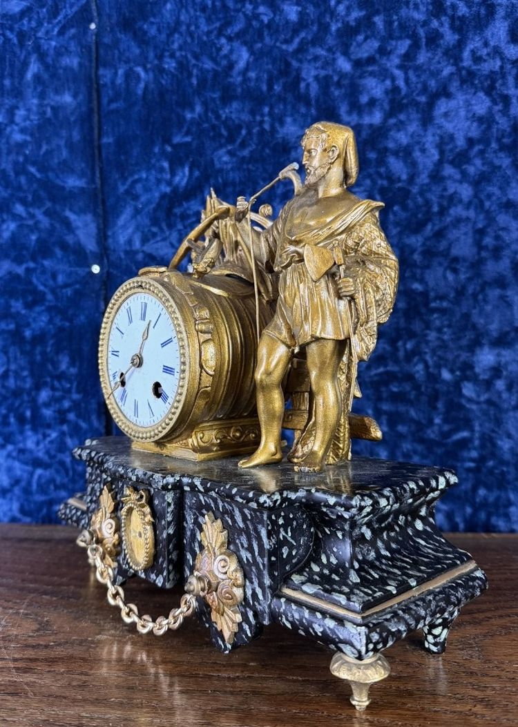 Napoleon III period clock in faux marble painted wood and gilded regule