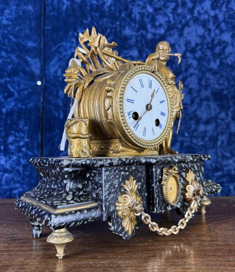 Napoleon III period clock in faux marble painted wood and gilded regule