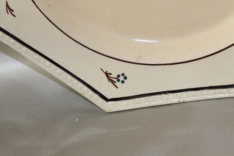Pair of Nevers earthenware ocotogonal beaded plates signed Dubois 18th century