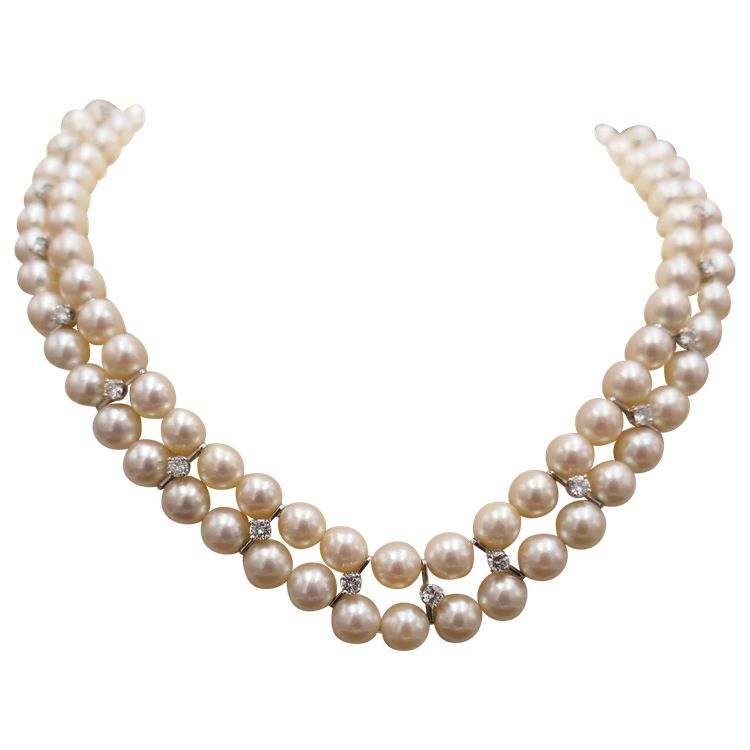 Double strand of pearls and diamonds 1.70 carat.