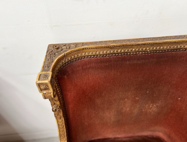 Deux bergères a oreilles de style Louis XVI en bois doré XX siècle