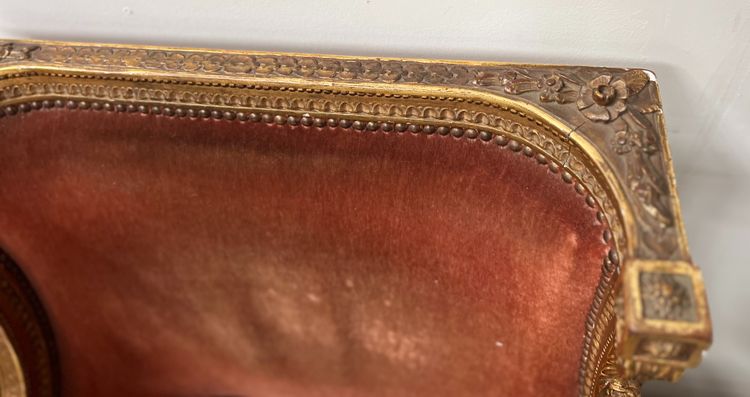 Deux bergères a oreilles de style Louis XVI en bois doré XX siècle