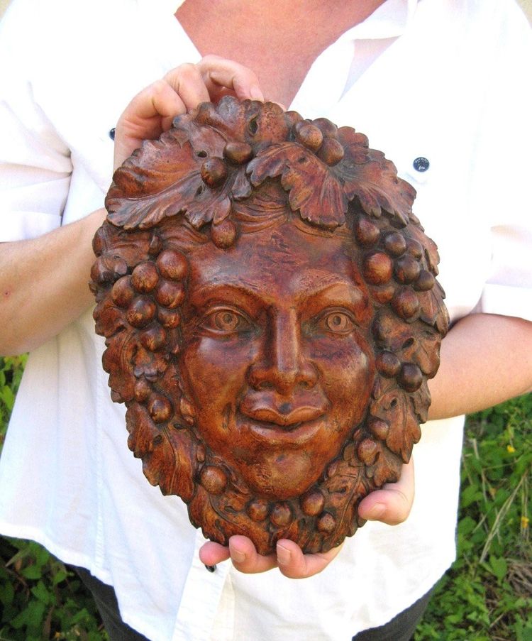 Bacchus head in glazed terracotta.