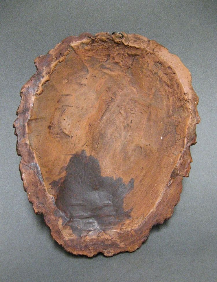 Bacchus head in glazed terracotta.