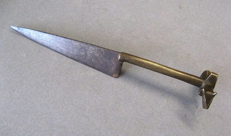 An ancient knife used to sacrifice Zebu during circumcision ceremonies.