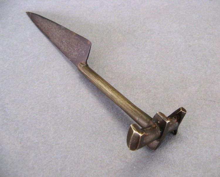 An ancient knife used to sacrifice Zebu during circumcision ceremonies.