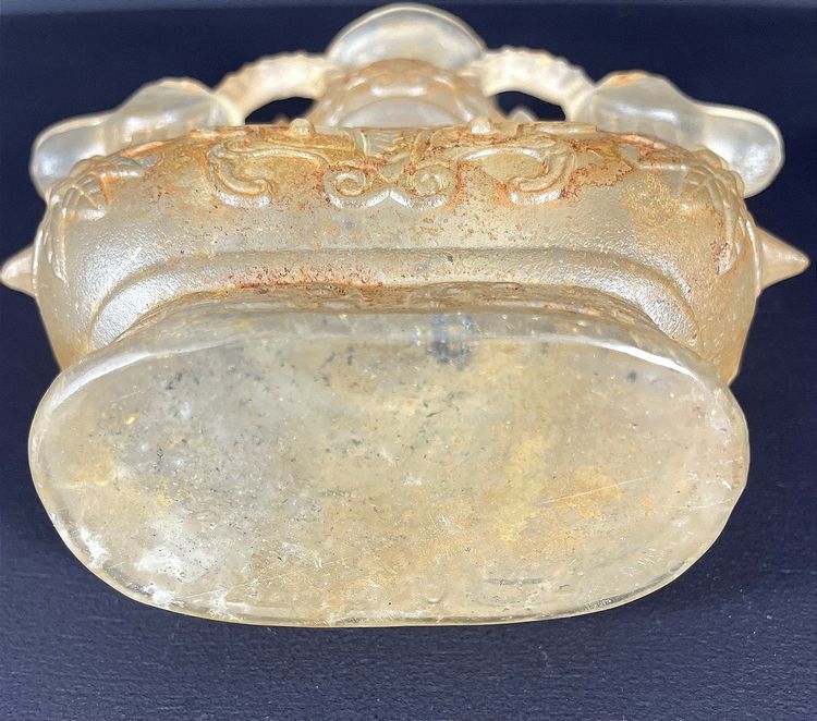 China, Qing Dynasty, early 19th century, candlestick in the form of a small vase surrounded by two rams.