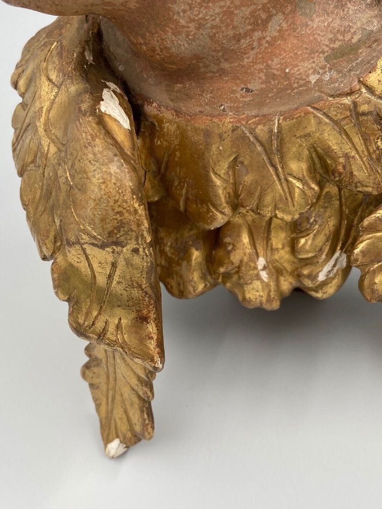 Head of a cherub in carved polychrome and gilded wood, 17th century, entourage of Ignaz Günther