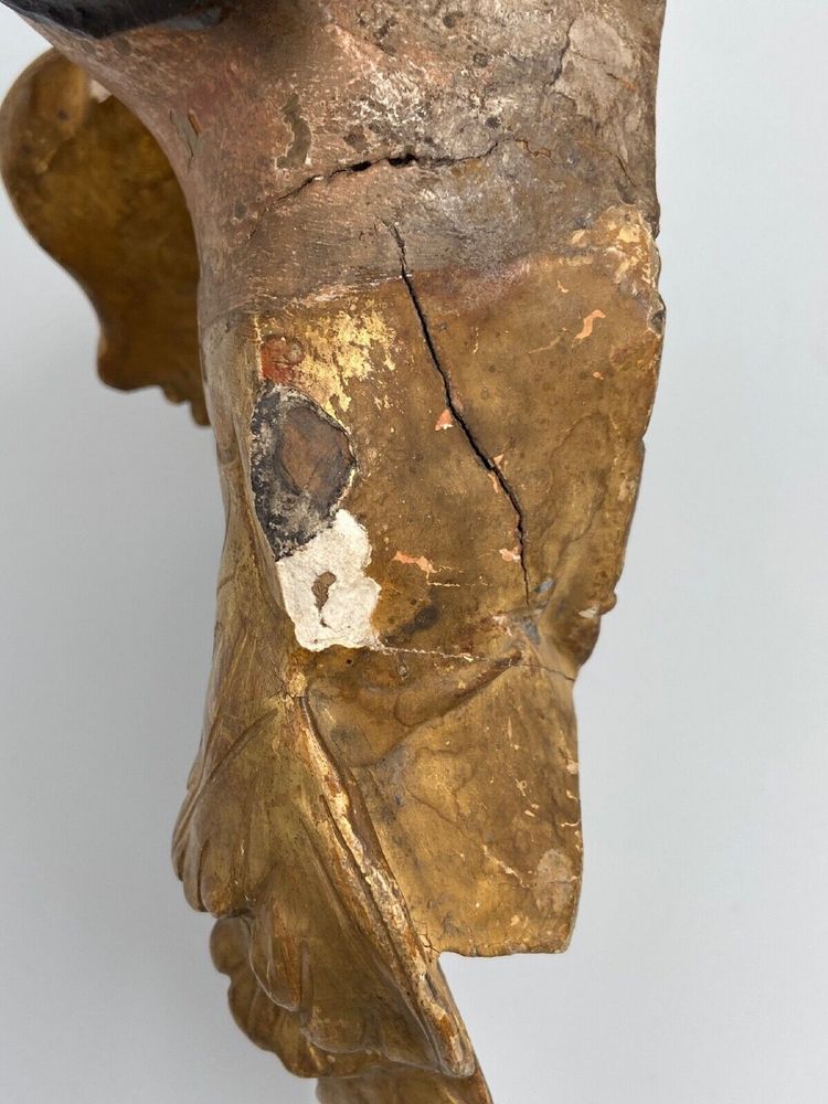Head of a cherub in carved polychrome and gilded wood, 17th century, entourage of Ignaz Günther