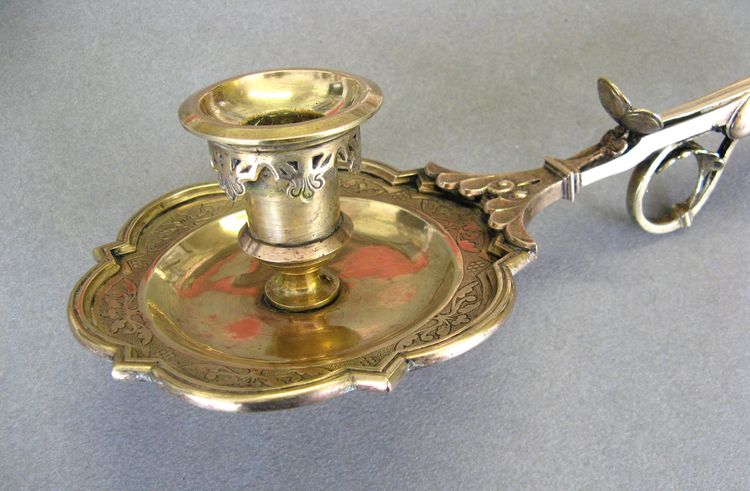 Bronze bishop candlestick with episcopal hand.