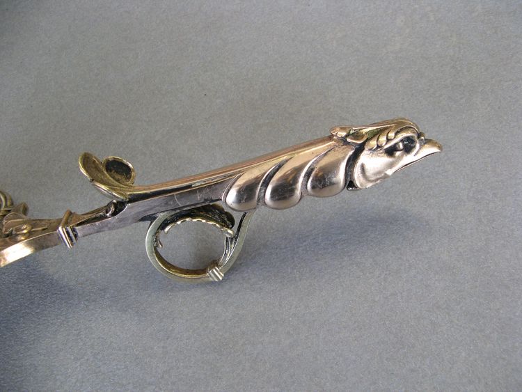 Bronze bishop candlestick with episcopal hand.