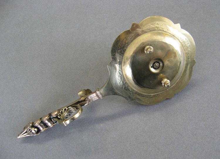 Bronze bishop candlestick with episcopal hand.