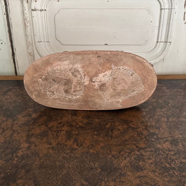 Terracotta statue representing Bacchus as a child on a barrel