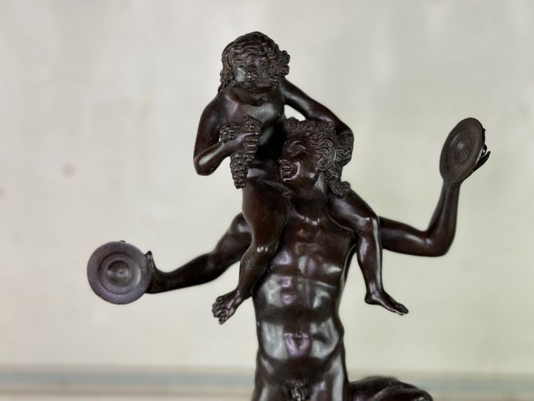 Dionysus on the Shoulders of a Satyr, Bronze after the Antique on a Sienna Yellow Base