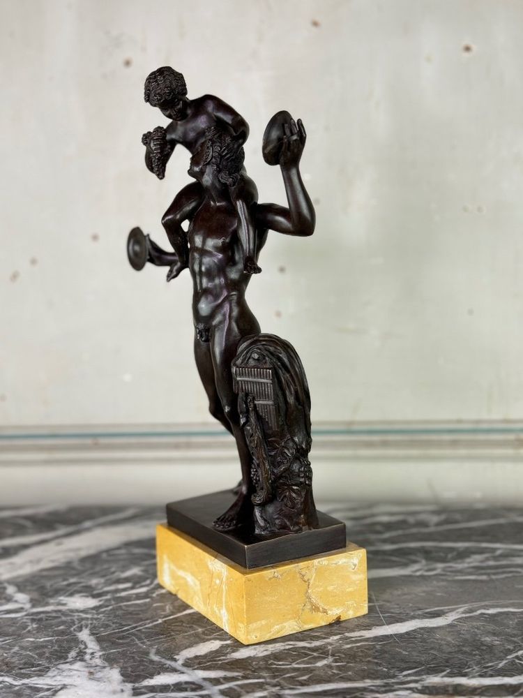 Dionysus on the Shoulders of a Satyr, Bronze after the Antique on a Sienna Yellow Base