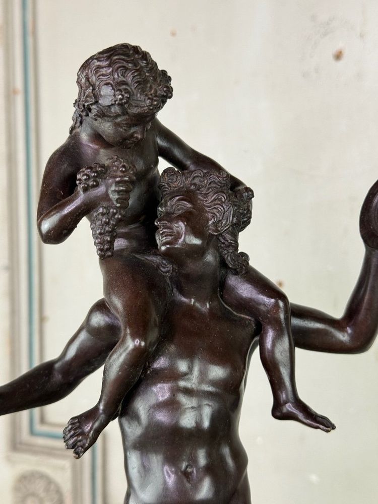 Dionysus on the Shoulders of a Satyr, Bronze after the Antique on a Sienna Yellow Base