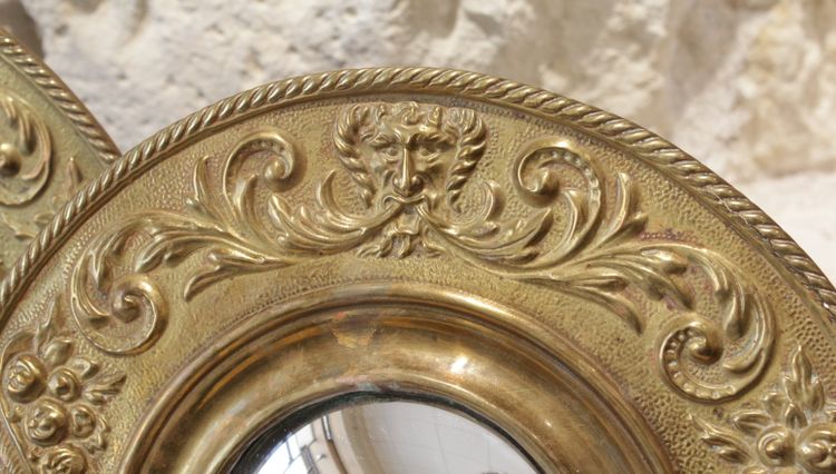 Pair of late 19th century embossed brass witch mirrors