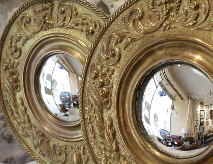 Pair of late 19th century embossed brass witch mirrors