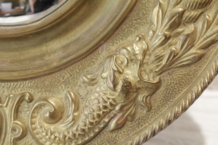 Pair of late 19th century embossed brass witch mirrors