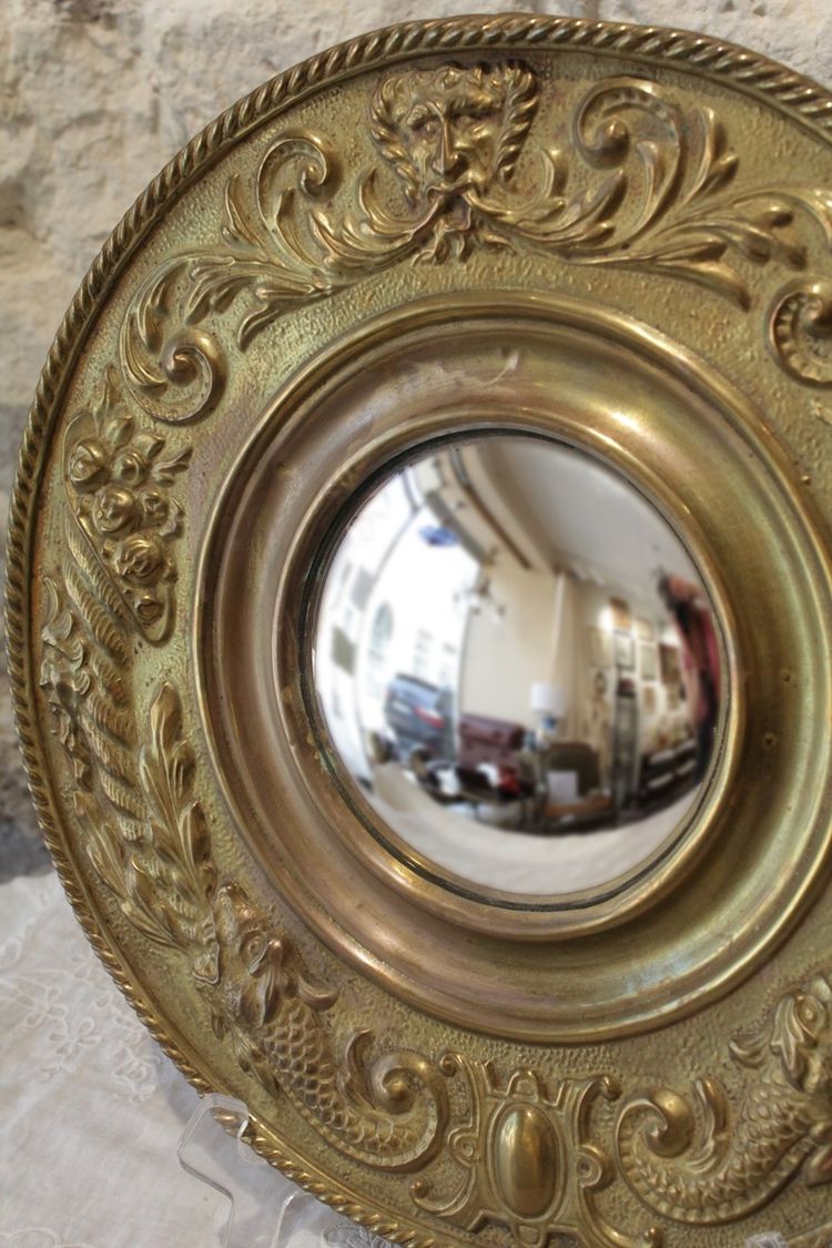 Pair of late 19th century embossed brass witch mirrors